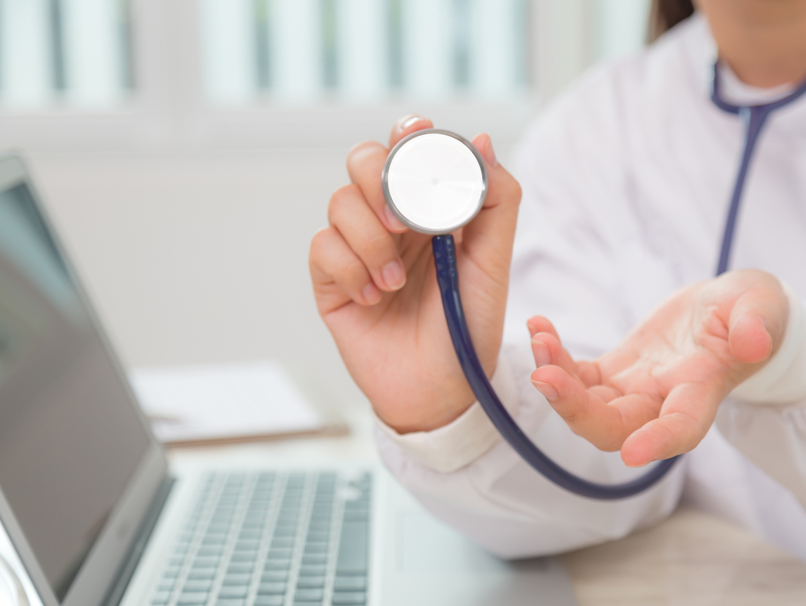 Close-up of specialist using a stethoscope