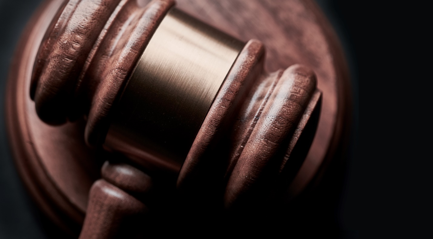 A gavel with a black background