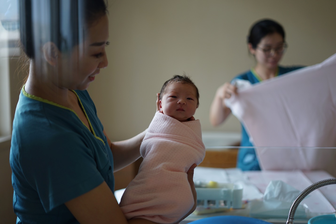 Nurse holding a baby