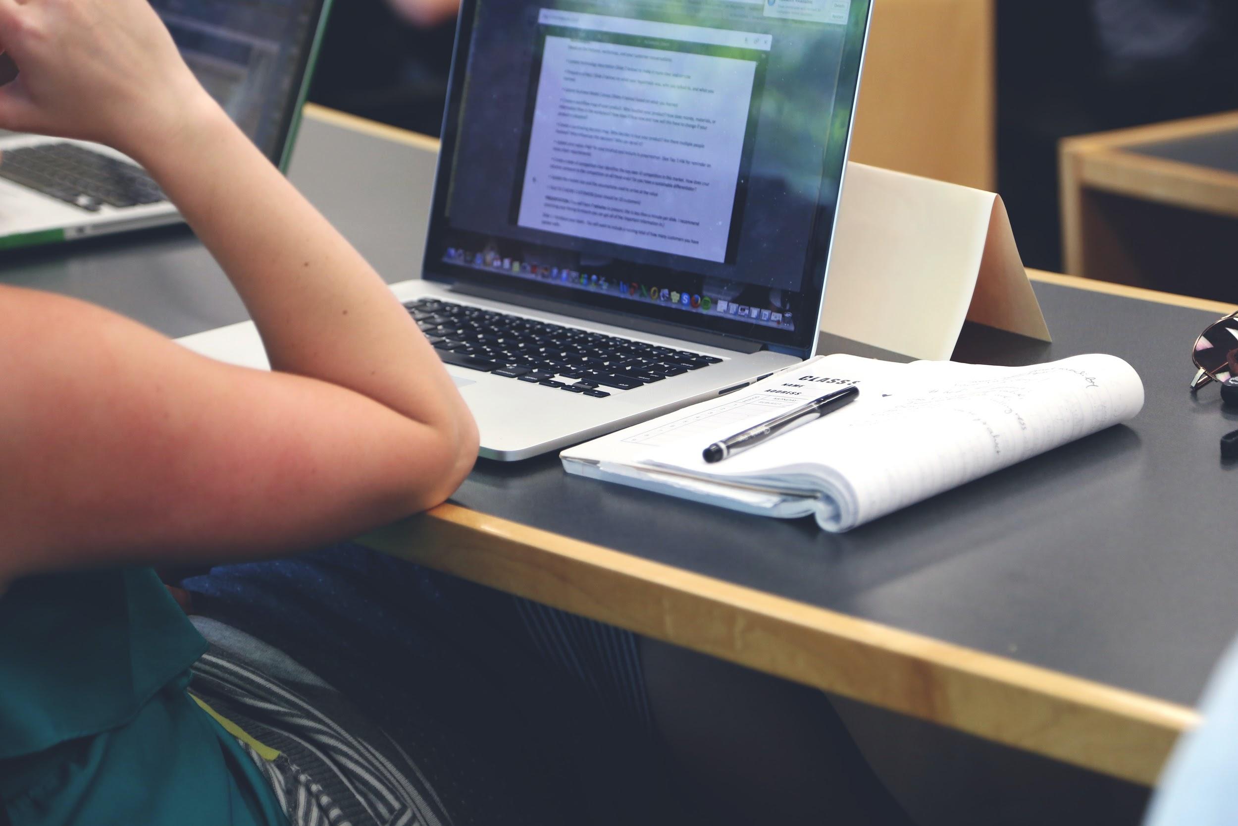 Student with a Macbook studying 