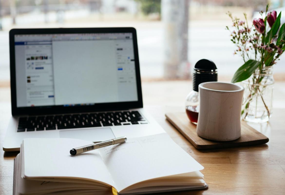 A laptop and a notebook