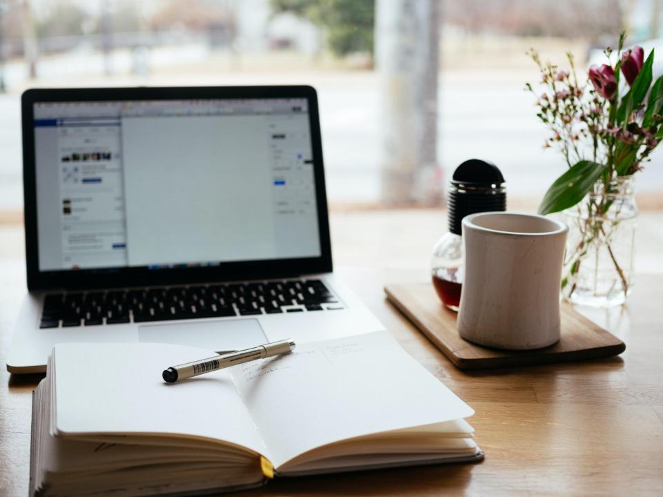 A laptop and a notebook