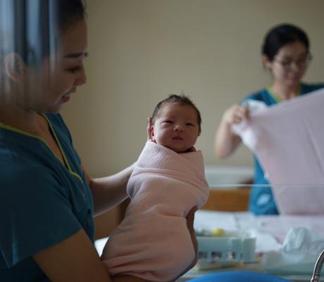 Nurse holding a baby