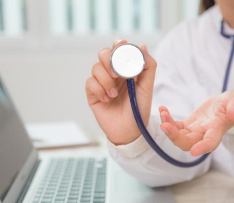 Close-up of specialist using a stethoscope