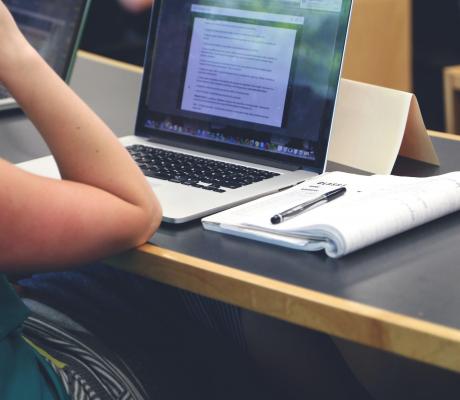 Student with a Macbook studying 