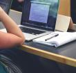Student with a Macbook studying 